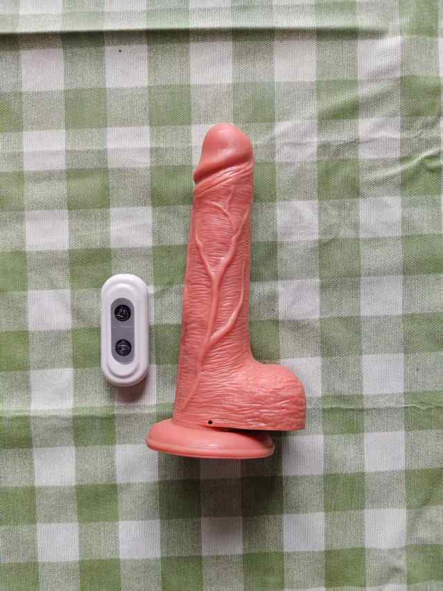 Large wireless electric vibrating and thrusting phallus (rechargeable)
